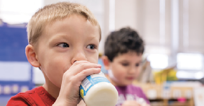 child drinking milk
